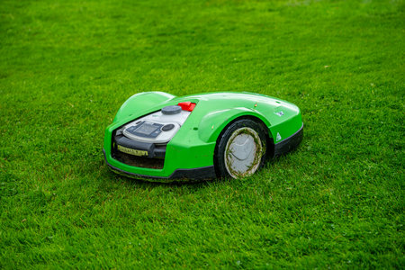 Lindesnes, Norway - August 26 2023: Robot lawn mower hard at workのeditorial素材