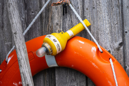 Lindesnes, Norway - June 28 2023: Lifebouy self-igniting light hanging from a lifebouyのeditorial素材