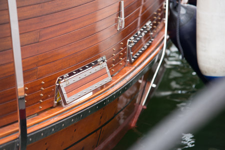 Elaborate deck side and metal fittings of a wooden boat