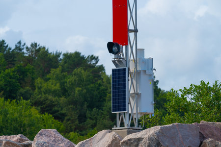 Port leading light powered by solar cellsの写真素材