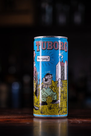Lindesnes, Norway - July 01 2023: Cartoon covered can of Tuborg beer