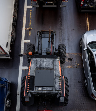 Horten, Norway - August 01 2023: Top down view of a tractor on the deck of a ferryのeditorial素材