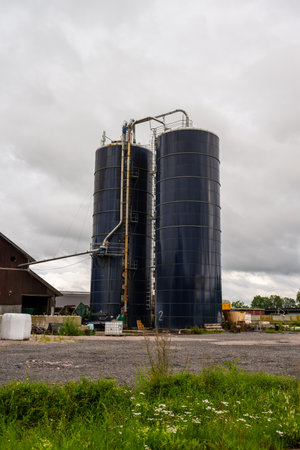 Uppsala, Sweden - August 10 2023: Large blue silos at a farmのeditorial素材