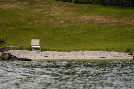 Sun chair by a small beachの写真素材