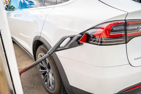 Halmstad, Sweden - July 10 2022: Tesla car charging at Tesla Supercharger Halmstad.のeditorial素材