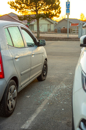 Gothenburg, Sweden - March 05 2021: Broken glass by the side of a car that has been broken into.のeditorial素材