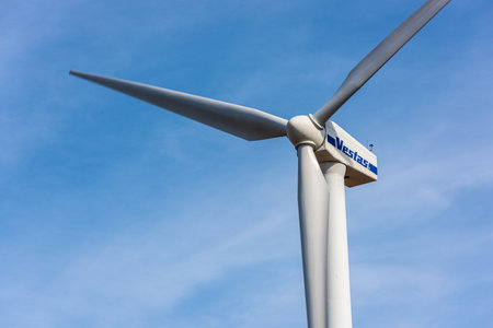 Gothenburg, Sweden - April 03 2022: Vestas wind turbine standing tall in the breeze.
