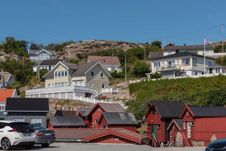 Lindesnes, Norway - August 03 2021: Houses and boat houses at Lillehavn.