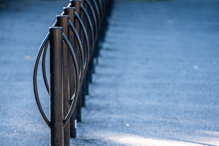 Long row of black metal bike racks.の写真素材