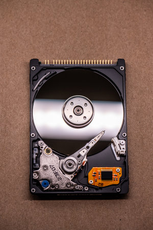 Mechanics inside a hard disk drive with platter and read write headの写真素材