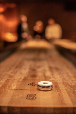 Playing the game of shuflleboard.