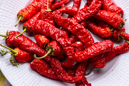 Red ripe peppers on a plate