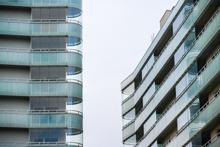 Rounded corner balconies on two apartment buildings