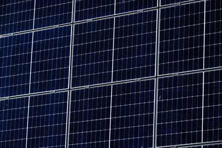 Multiple Solar panels on a warehouse wallの写真素材