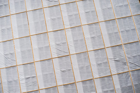 White plastic covering the facade of a building