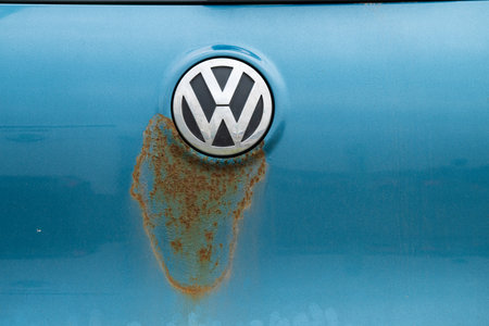 Gothenburg, Sweden - March 01 2024: Rust spreading from a Volkswagen symbol on a blue carのeditorial素材