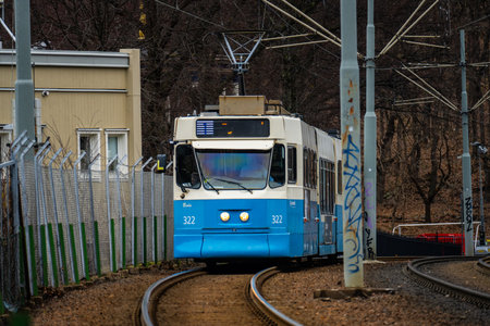 Gothenburg, Sweden - February 24 2024: Blue and white tram on a separated trackのeditorial素材