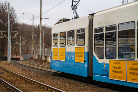 Gothenburg, Sweden - February 24 2024: Blue and white tram on a separated trackのeditorial素材