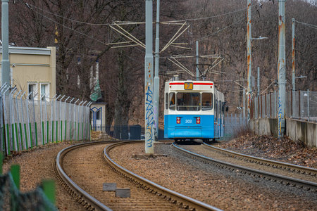 Gothenburg, Sweden - February 24 2024: Blue and white tram on a separated trackのeditorial素材