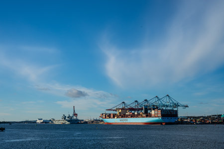 Gothenburg, Sweden - October 16 2023: Large Maersk container vessel and HMS Queen Elizabeth aircraft carrier at portのeditorial素材