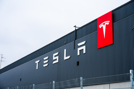 Stockholm, Sweden - March 09 2024: Tesla logo on the facade of a large workshopのeditorial素材