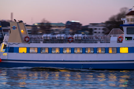 Gothenburg, Sweden - March 07 2024: Side of a passenger ferry in the eveningのeditorial素材
