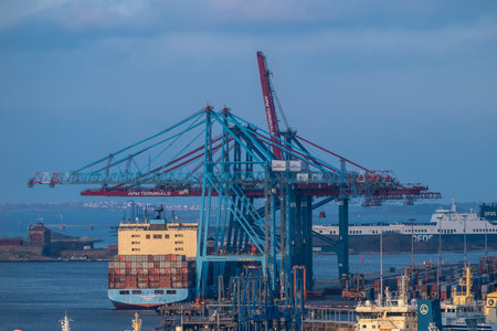 Gothenburg, Sweden - March 05 2024: Large Maersk container vessel loading at Skandiahamnenのeditorial素材