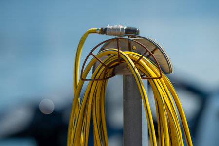 Yellow garden hose on a holder