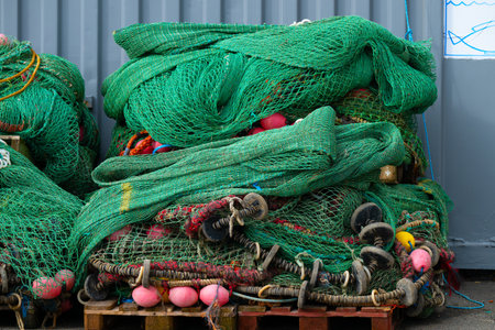 Green fishing trawls in storageの写真素材