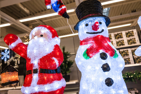 Illuminated santa claus and snow man christmas decorationsの写真素材
