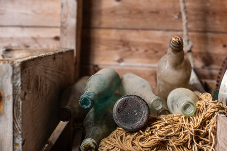 Old dusty glass flasks in a pileの写真素材