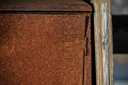 Hinge of an old rusty junction boxの写真素材