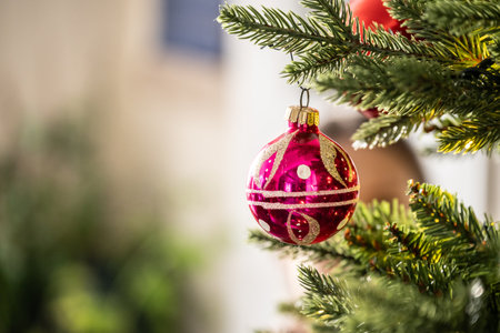 Christmas ornament hanging from a christmas treeの写真素材