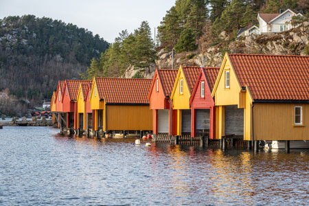Row of red and yellow boat housesの写真素材