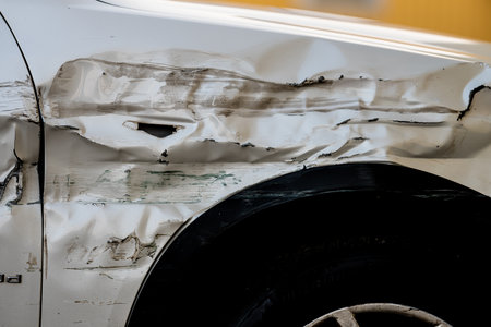 Badly crashed side of a white carの写真素材
