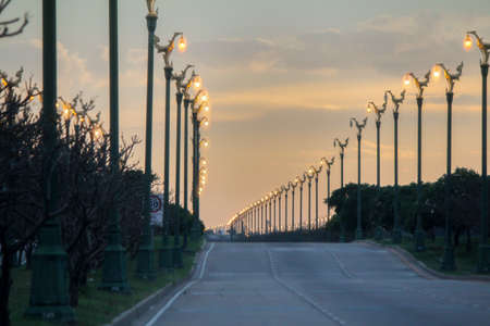 Sunset orange sky with long roadの写真素材