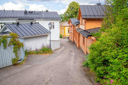 Colorful historic houses in the Old Town of Naantali, Finland. Lots of tourists are wandering around on these streets during the summer time.のeditorial素材
