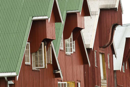 Telephoto view of a row of painted timber houses