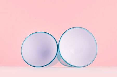 Youth interior with circle white abstract spheres with blue rim on white wood board and pastel pink background.の写真素材