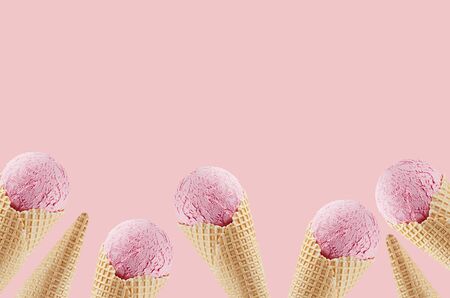 Summer food decorative border of delicious strawberry ice cream in crisp waffle cones on pink...
