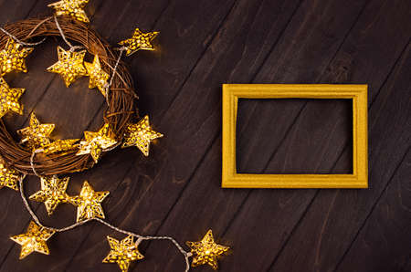Fashion festive christmas background -  wreath of branches, blank frame for text,  glowing stars on...
