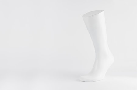 Perfect white male mannequin foot on white background with copy space, mock up for presentation, design, advertising, front view.の写真素材