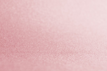 Soft light pink shining glowing bokeh abstract texture for Christmas and festive design.の写真素材