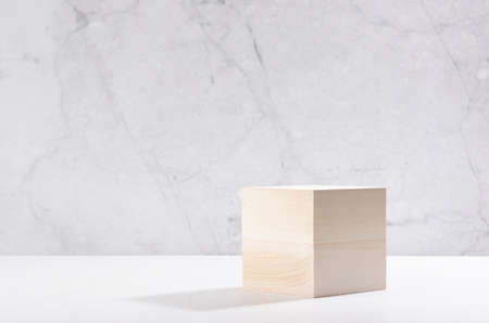 Beige natural cube podium in white and gray marble interior  sun light and shadow.の写真素材