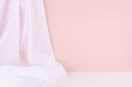 Abstract modern minimal scene or interior with soft light pastel pink wall, white silk curtain and white wood table of floor. Background for display, presentation, showing.の写真素材