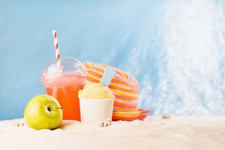 Summer lifestyle on seaside coast on sunny beach with ocean view, white sand with picnic of takeaway...