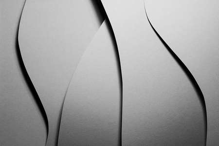 Carbon gray abstract geometric background with soar vertical curved waves pattern in hard light with black shadows as monochrome stylish backdrop in elegant simple modern minimal style, top view.の写真素材