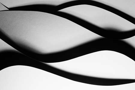 Gray and white abstract geometric background with soar stepped horizontal curved wavy stripes in...
