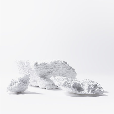 White podiums mockup of foam as abstract snowy cliffs for presentation cosmetics products or goods in sun beam with glare, square. Template stage in rough industrial fashion style.の写真素材
