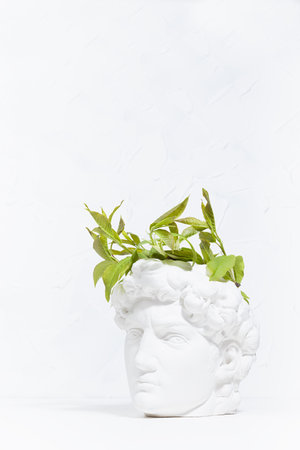 Idea concept with head of white antique statue David and abstract image of his thinking process as...